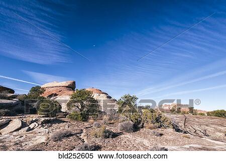 Stock Photography - "Blue sky over rocks in desert, Moab, Utah, United States". Fotosearch