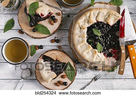 Picture - Blueberry pie on wooden table. Fotosearch
