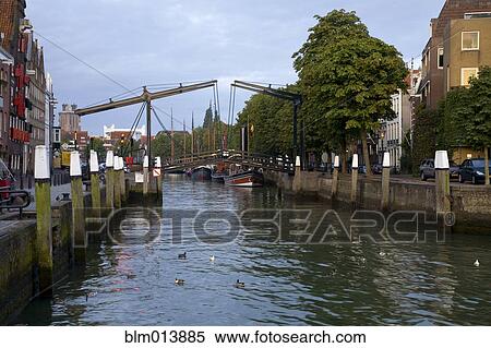 Stock Photography - Boats in Amsterdam canals. Fotosearch