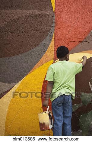 Boy painting wall View Large Photo Image Stock Photograph - Boy painting wall. Fotosearch
