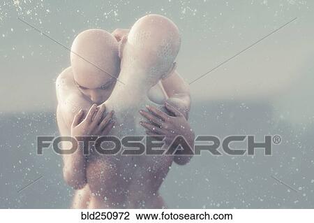 Bubbles floating near futuristic hugging woman View Large Photo Image Stock Image - Bubbles floating near futuristic hugging woman. Fotosearch