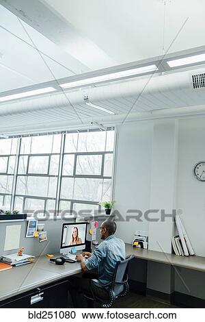 Stock Image - Business people on video conference. Fotosearch