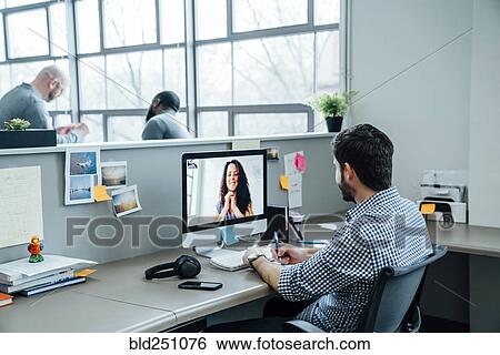 Business people on video conference View Large Photo Image Stock Photograph - Business people on video conference. Fotosearch