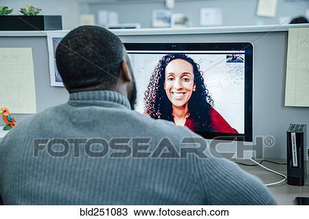 Stock Image - Business people on videoconference. Fotosearch