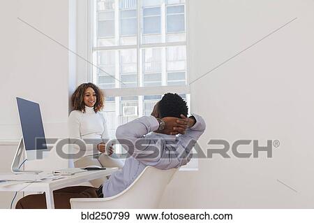 Stock Photo - Business people relaxing. Fotosearch