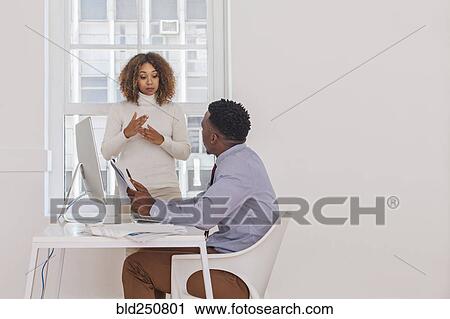 Stock Image - Business people talking. Fotosearch