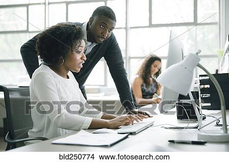 Business people using computer in office View Large Photo Image Picture - Business people using computer in office. Fotosearch