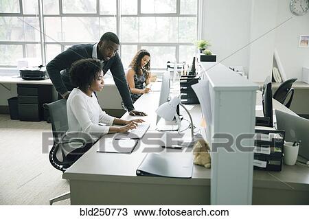 Business people using computer in office View Large Photo Image Stock Image - Business people using computer in office. Fotosearch