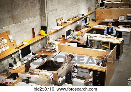 Business people working in busy office View Large Photo Image Stock Photograph - Business people working in busy office. Fotosearch