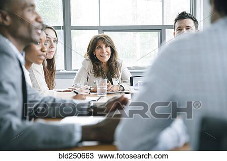 Businesspeople in meeting View Large Photo Image Stock Image - Businesspeople in meeting. Fotosearch