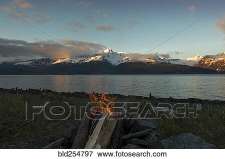 Campfire near mountain river View Large Photo Image Stock Photo - Campfire near mountain river. Fotosearch