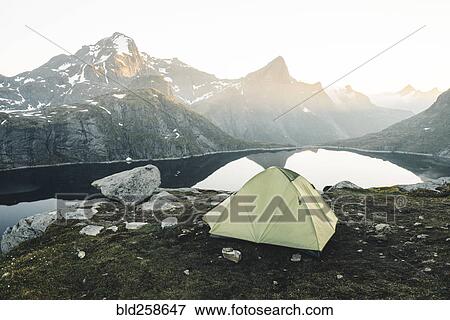 Camping tent near mountain lake View Large Photo Image Stock Photo - Camping tent near mountain lake. Fotosearch