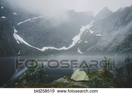 Camping tent near river in fog View Large Photo Image Stock Photo - Camping tent near river in fog. Fotosearch
