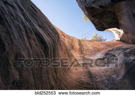 Canyon walls under blue sky View Large Photo Image Stock Image - Canyon walls under blue sky. Fotosearch