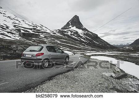 Car driving on road in winter landscape View Large Photo Image Stock Photo - Car driving on road in winter landscape. Fotosearch
