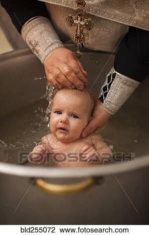 Caucasian baby boy being baptized View Large Photo Image Stock Image - Caucasian baby boy being baptized. Fotosearch