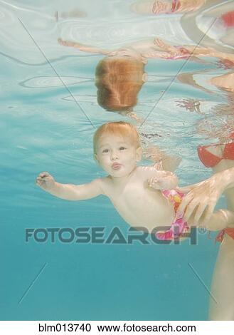 Caucasian baby swimming underwater View Large Photo Image Stock Image - Caucasian baby swimming underwater. Fotosearch