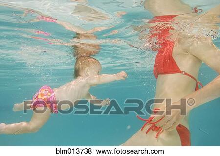 Caucasian baby swimming underwater View Large Photo Image Stock Photo - Caucasian baby swimming underwater. Fotosearch