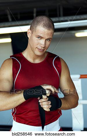 Caucasian boxer wrapping hands View Large Photo Image Stock Photograph - Caucasian boxer wrapping hands. Fotosearch