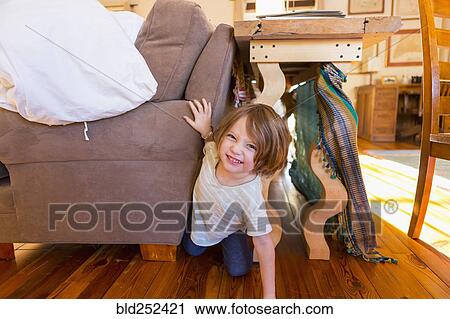 Caucasian boy crawling on floor between table and sofa View Large Photo Image Stock Image - Caucasian boy crawling on floor between table and sofa. Fotosearch