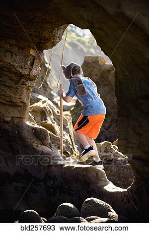 Caucasian boy hiking on rocks View Large Photo Image Stock Image - Caucasian boy hiking on rocks. Fotosearch