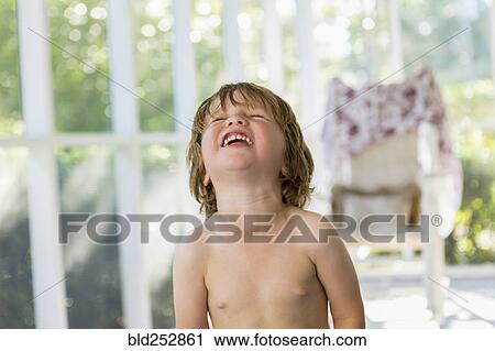 Stock Image - Caucasian boy laughing. Fotosearch