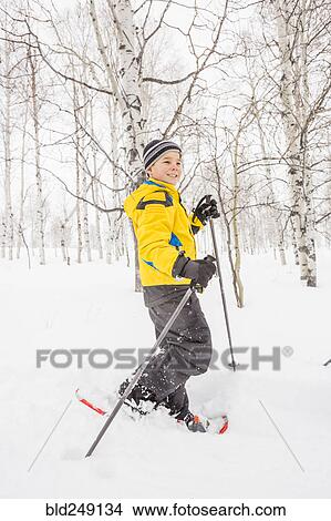 Caucasian boy snowshoeing View Large Photo Image Picture - Caucasian boy snowshoeing. Fotosearch