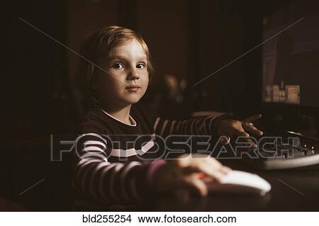 Picture - Caucasian boy using computer. Fotosearch