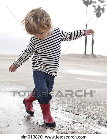 Caucasian boy walking on beach View Large Photo Image Stock Image - Caucasian boy walking on beach. Fotosearch