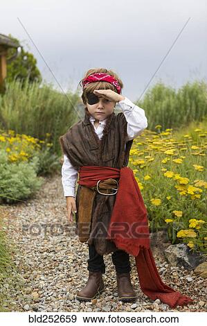 Caucasian boy wearing a pirate costume searching View Large Photo Image Stock Photo - Caucasian boy wearing a pirate costume searching. Fotosearch