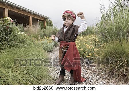 Caucasian boy wearing pirate costume holding knife View Large Photo Image Stock Image - Caucasian boy wearing pirate costume holding knife. Fotosearch