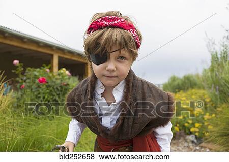 Stock Photo - Caucasian boy wearing pirate costume. Fotosearch