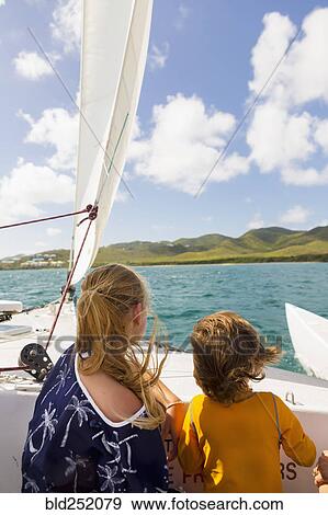 Caucasian brother and sister on sailboat View Large Photo Image Stock Photo - Caucasian brother and sister on sailboat. Fotosearch