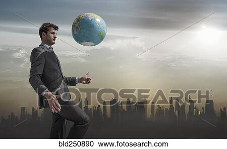 Caucasian businessman juggling globe near city skyline View Large Photo Image Stock Image - Caucasian businessman juggling globe near city skyline. Fotosearch