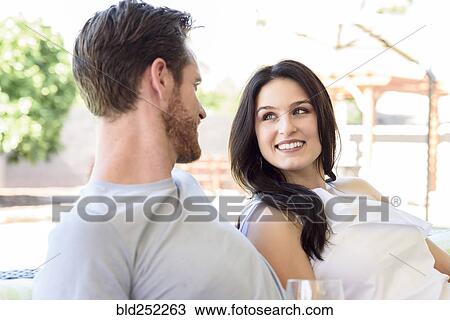 Caucasian couple relaxing and smiling View Large Photo Image Stock Image - Caucasian couple relaxing and smiling. Fotosearch