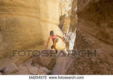 Caucasian girl climbing in canyon View Large Photo Image Stock Image - Caucasian girl climbing in canyon. Fotosearch
