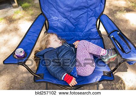 Caucasian girl sleeping on folding chair View Large Photo Image Stock Image - Caucasian girl sleeping on folding chair. Fotosearch