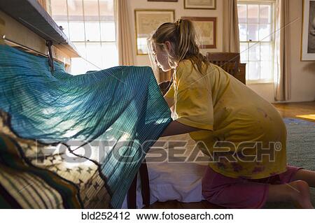 Caucasian girls building fort under table View Large Photo Image Stock Image - Caucasian girls building fort under table. Fotosearch