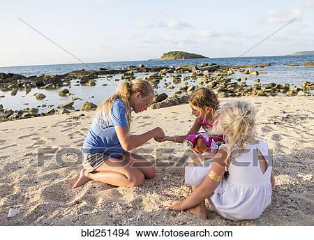 Caucasian girls playing at beach View Large Photo Image Picture - Caucasian girls playing at beach. Fotosearch