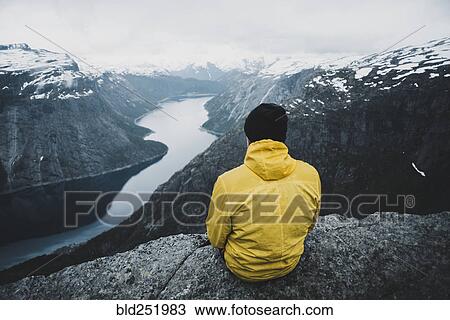 Caucasian man admiring scenic view of mountain river View Large Photo Image Stock Image - Caucasian man admiring scenic view of mountain river. Fotosearch