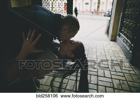 Caucasian man dipping and kissing woman View Large Photo Image Stock Photograph - Caucasian man dipping and kissing woman. Fotosearch