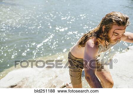 Caucasian man exiting river View Large Photo Image Stock Photo - Caucasian man exiting river. Fotosearch