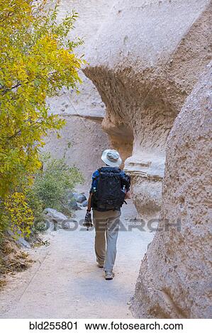 Caucasian man hiking near boulders View Large Photo Image Stock Image - Caucasian man hiking near boulders. Fotosearch