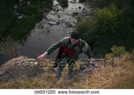 Caucasian man hiking near river View Large Photo Image Stock Image - Caucasian man hiking near river. Fotosearch