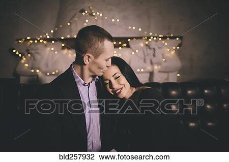 Caucasian man kissing forehead of woman View Large Photo Image Stock Image - Caucasian man kissing forehead of woman. Fotosearch
