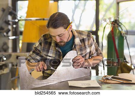 Caucasian man measuring metal with caliper View Large Photo Image Stock Photography - Caucasian man measuring metal with caliper. Fotosearch