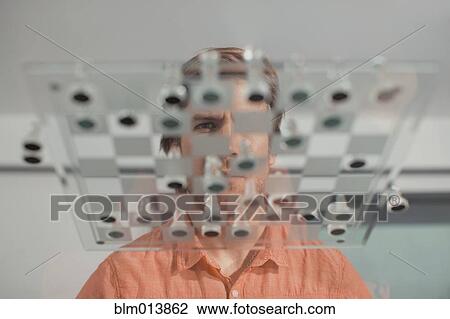 Caucasian man playing chess View Large Photo Image Stock Image - Caucasian man playing chess. Fotosearch
