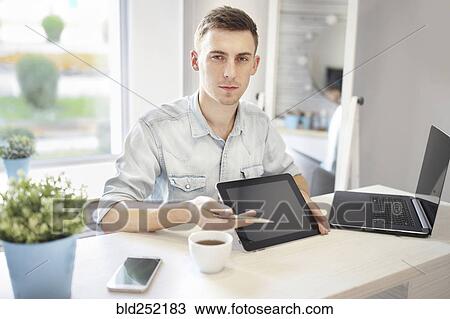 Caucasian man showing digital tablet View Large Photo Image Stock Image - Caucasian man showing digital tablet. Fotosearch