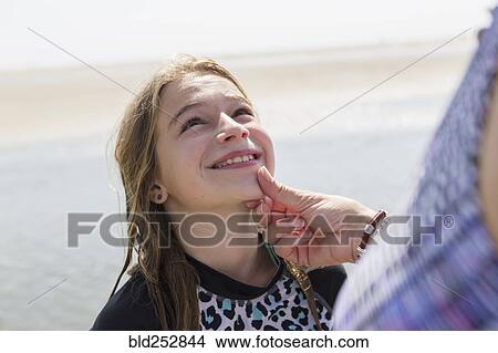 Caucasian mother admiring face of daughter View Large Photo Image Picture - Caucasian mother admiring face of daughter. Fotosearch