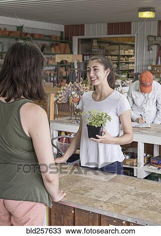 Caucasian mother and daughter talking in store View Large Photo Image Stock Image - Caucasian mother and daughter talking in store. Fotosearch